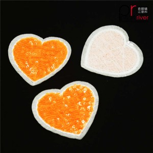 Narancssárga szív alakú flitter javítás